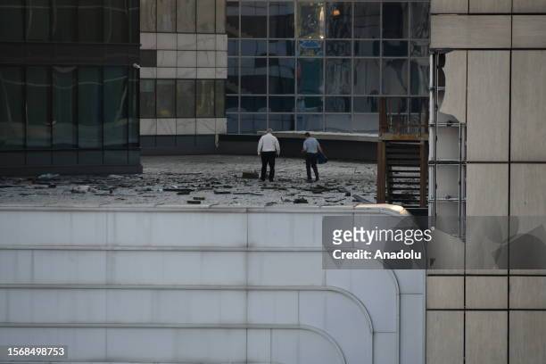 Security forces inspect at the scene after a skyscraper attacked by a drone for the second time in two days in Moscow, Russia on August 01, 2023. On...