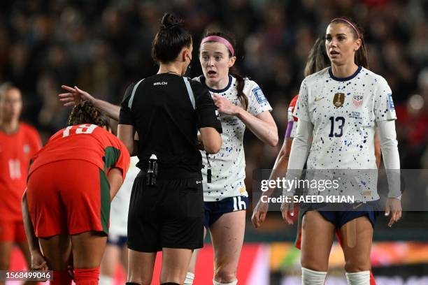 English referee Rebecca Welch speaks with USA's midfielder Rose Lavelle during the Australia and New Zealand 2023 Women's World Cup Group E football...