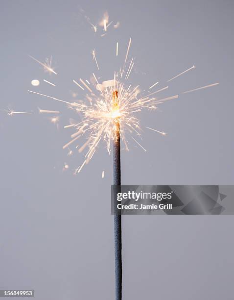 studio shot of sparkler - sparkler firework stock-fotos und bilder