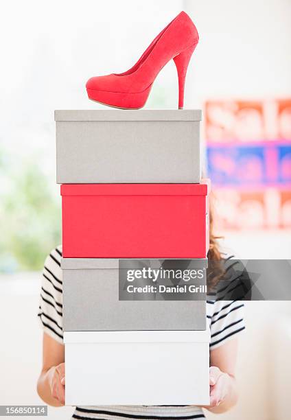 woman carrying shoes boxes - shoe box ストックフォトと画像