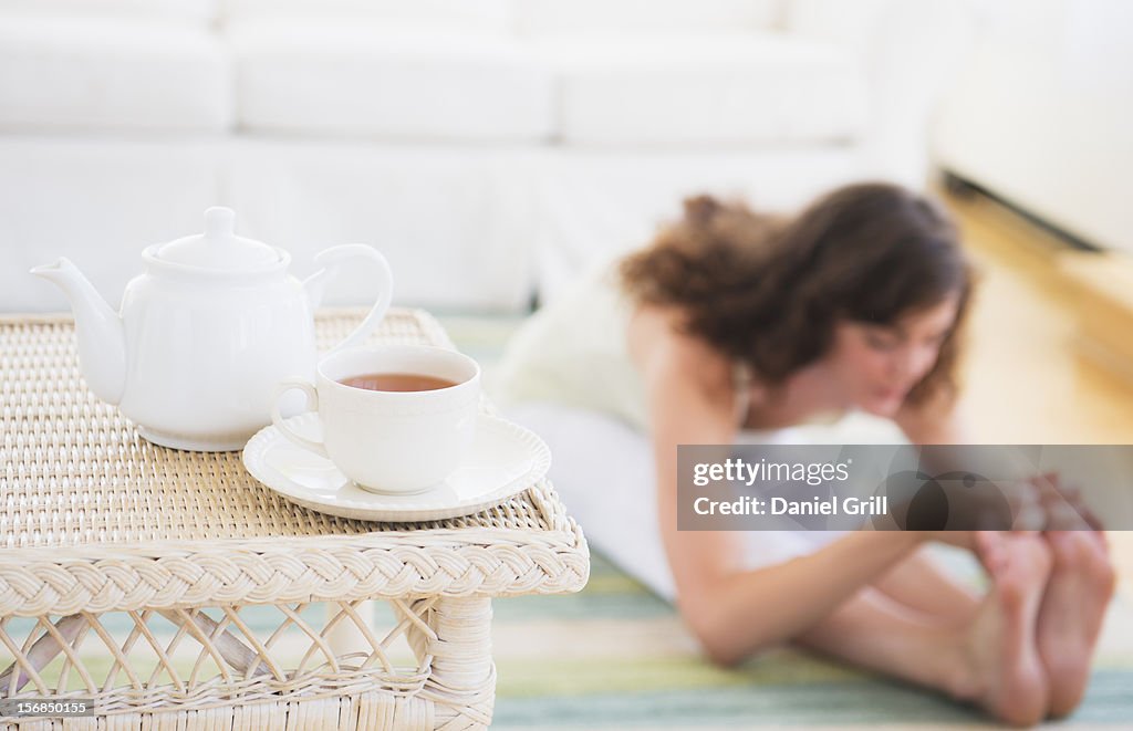 Young woman exercising at home