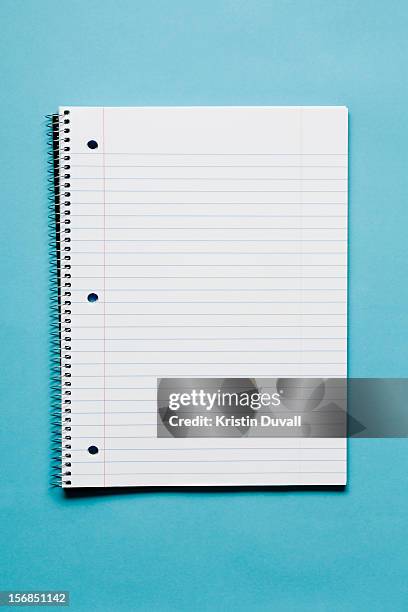 blank spiral notebook on blue background - journal stock-fotos und bilder
