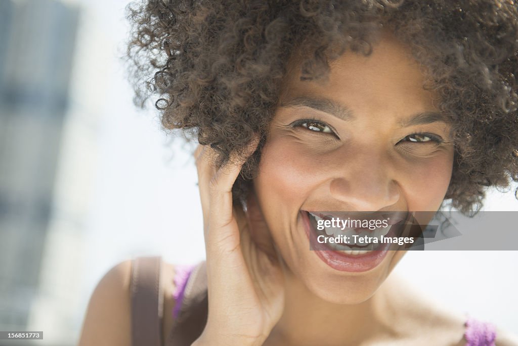 USA, New Jersey, Jersey City, Portrait of woman laughing