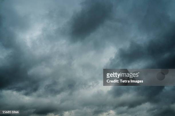 stormy sky - dark sky stock-fotos und bilder