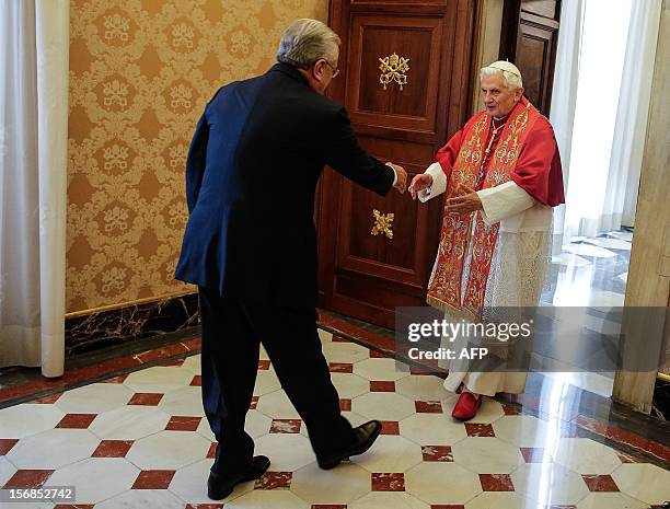 Pope Benedict XVI welcomes Lebanon's President Michel Sleiman during a private audience at the Vatican, on November 23, 2012. AFP PHOTO / POOL / Tony...