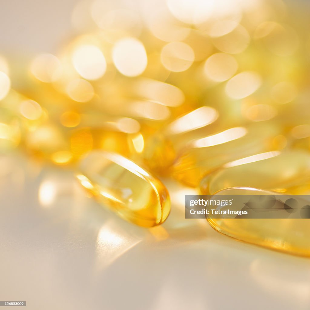 Omega fatty acid pills on white background, studio shot