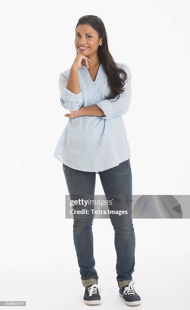 Studio shot of young woman smiling