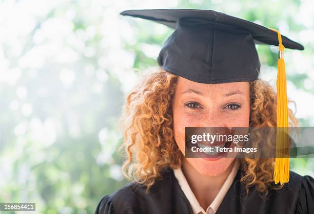 usa, new jersey, jersey city, portrait of smiling young woman in mortarboard - close up of beautiful young blonde woman with black hat stock pictures, royalty-free photos & images