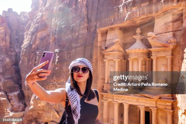 woman traveling alone in petra, jordan - jordan stock pictures, royalty-free photos & images