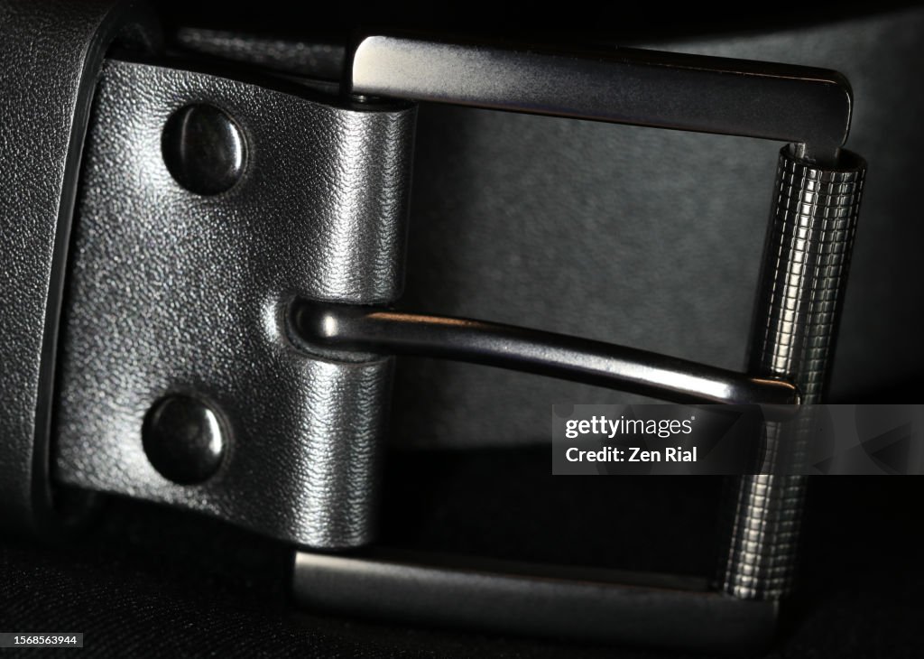 Silver colored Belt buckle on black