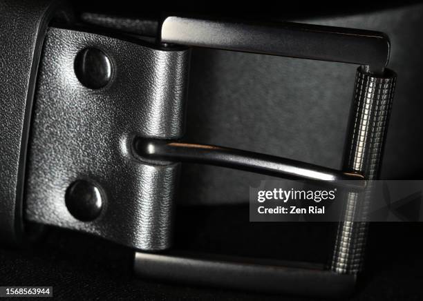 silver colored belt buckle on black - grey belt stock pictures, royalty-free photos & images