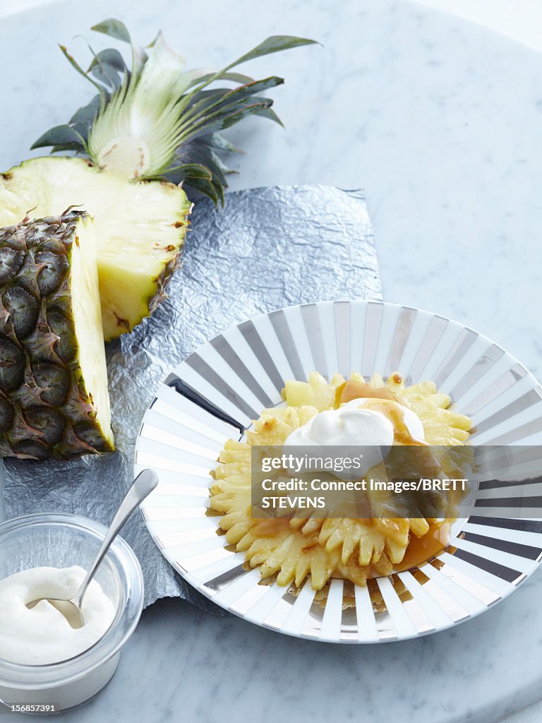Plate of sliced pineapple and caramel