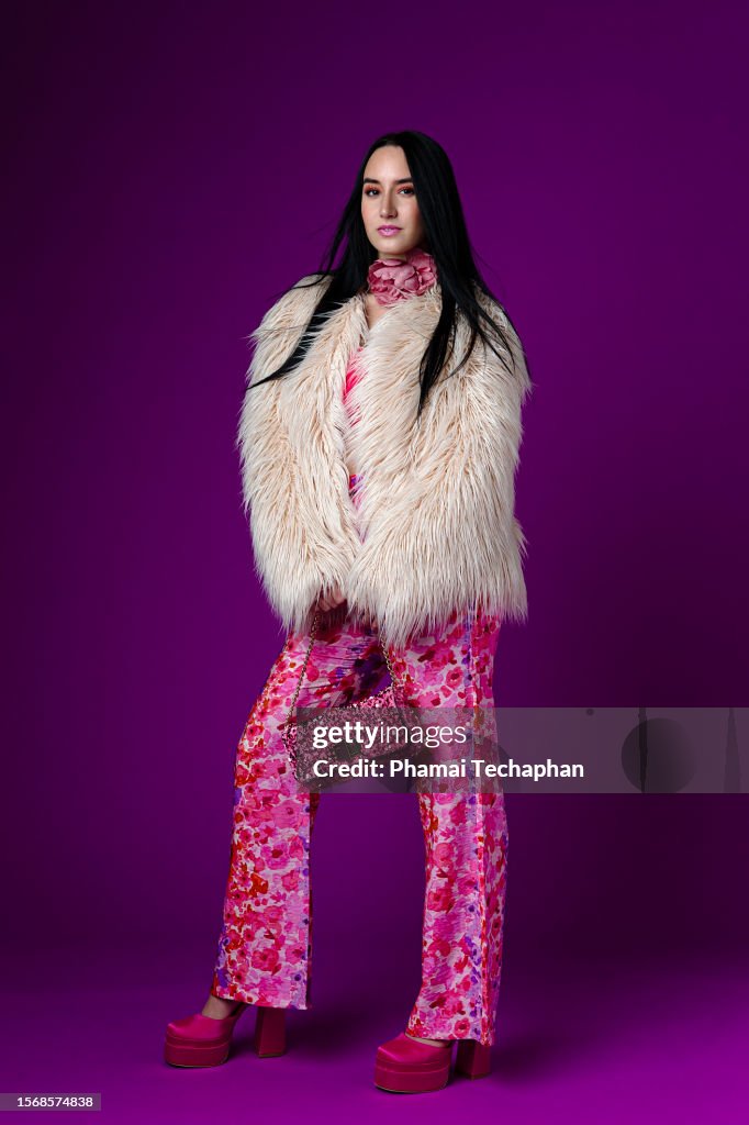 Fashionable woman against plain background