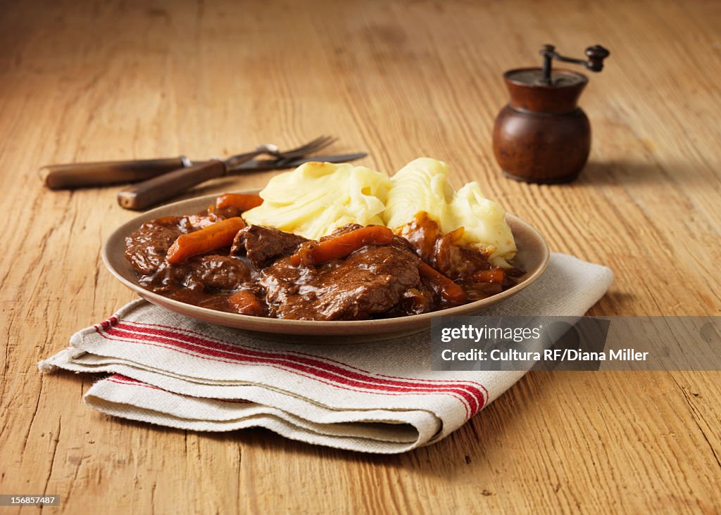 Plate of braised beef with potatoes