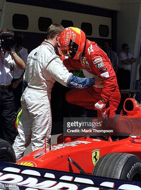 Michael Schumacher and Ralf Schumacher of Germany celebrates his pole position after the Qualifying session for the Austrian Grand Prix at the A1...