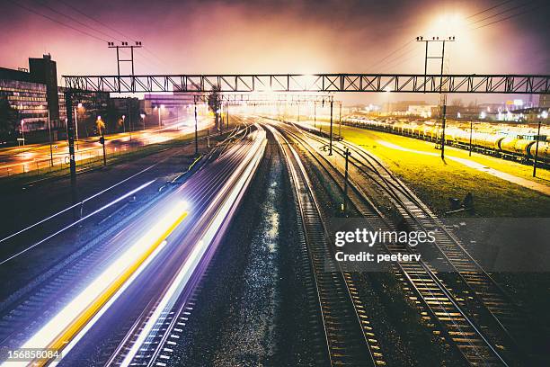 railroad traffic by night. - train yard at night stock pictures, royalty-free photos & images
