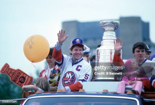 Denis Potvin of the New York Islanders waves to the crowd during the 1983 Stanley Cup Parade after they defeated the Edmonton Oilers on May 19, 1983...