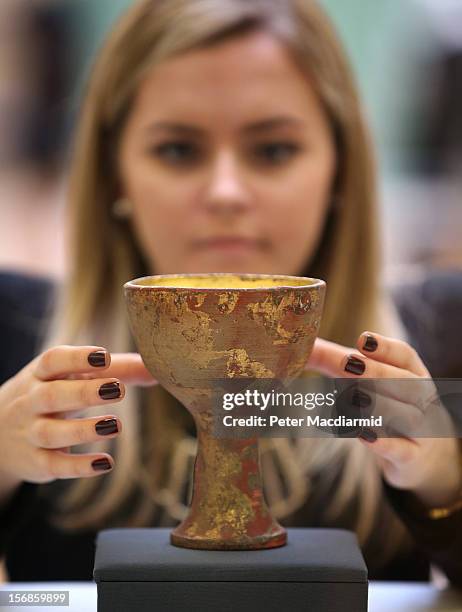 Prop chalice from Indiana Jones And The Last Crusade is shown at Christie's on November 23, 2012 in London, England. Estimated at £2500 - £3500 it...