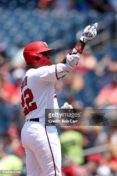 Dominic Smith of the Washington Nationals celebrates after hitting a two RBI single against the San Francisco Giants at Nationals Park on July 23,...