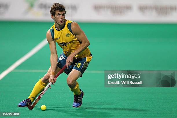 Tristan White looks to hit the ball during the Australia v India game during day two of the 2012 International Super Series at Perth Hockey Stadium...