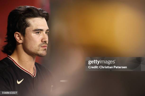 Corbin Carroll of the Arizona Diamondbacks watches from the dugout during the third inning of the MLB game against the St. Louis Cardinals at Chase...