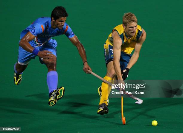Rupinder Pal Singh of India and Craig Boyne of the Kookaburras contest for the ball in the mens Australia Kookaburras v India game during day two of...