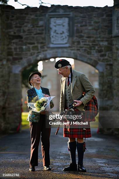 Pamela Countess of Mansfield and piper Malcolm Innes from Kilspindie help unveil the restored historic archway at Scone Palace on November 23, 2012...