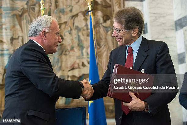 Palestinian Foreign Minister Riad Malki shakes hand with Italian Foreign Minister Giulio Terzi during a minsterial commitee at Farnesina on November...