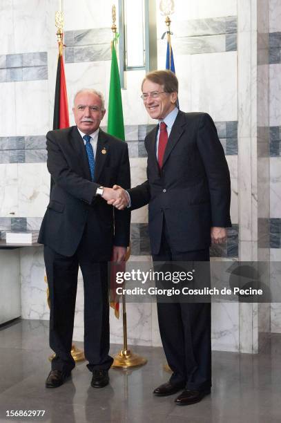 Palestinian Foreign Minister Riad Malki shakes hand with Italian Foreign Minister Giulio Terzi prior a minsterial commitee at Farnesina on November...