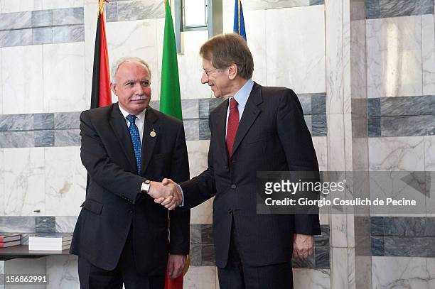Palestinian Foreign Minister Riad Malki shakes hand with Italian Foreign Minister Giulio Terzi prior a minsterial commitee at Farnesina on November...