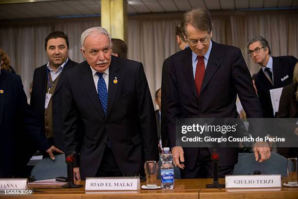 Palestinian Foreign Minister Riad Malki arrives with Italian Foreign Minister Giulio Terzi to attend a ministerial committee at Farnesina on November...
