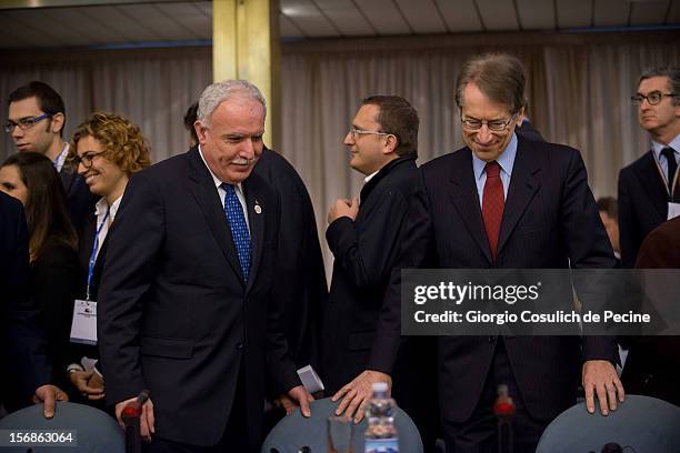 Palestinian Foreign Minister Riad Malki arrives with Italian Foreign Minister Giulio Terzi to attend a ministerial committee at Farnesina on November...