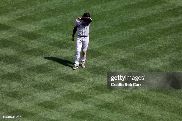 Wilmer Flores of the San Francisco Giants reacts after being doubled off of first base for the third out of the eighth inning against the Washington...