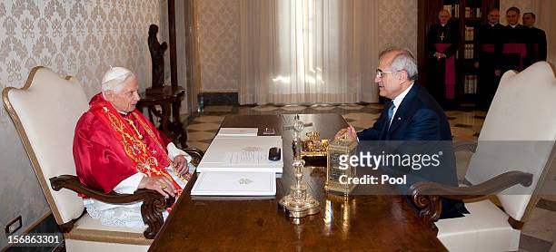 Pope Benedict XVI meets with Lebanon President Michel Sleiman at his private library on November 23, 2012 in Vatican City, Vatican. The meeting comes...