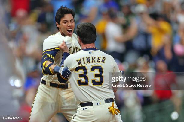 Christian Yelich of the Milwaukee Brewers celebrates a walk off RBI single with Jesse Winker to defeat the Cincinnati Reds during the ninth inning at...