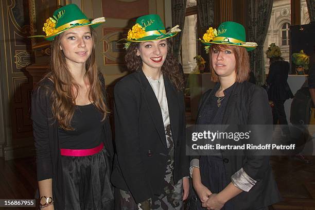 Young employees of the Pierre Berge - Yves Saint-Laurent Foundation pose prior to parading at the Paris City Hall during the Sainte-Catherine...