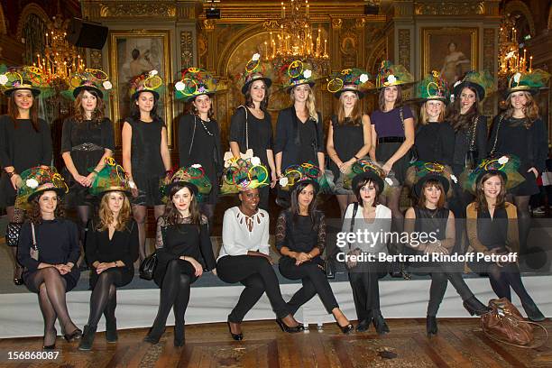 Young employees of the Chanel fashion house pose at the Paris City Hall during the Sainte-Catherine Celebration on November 23, 2012 in Paris, France.