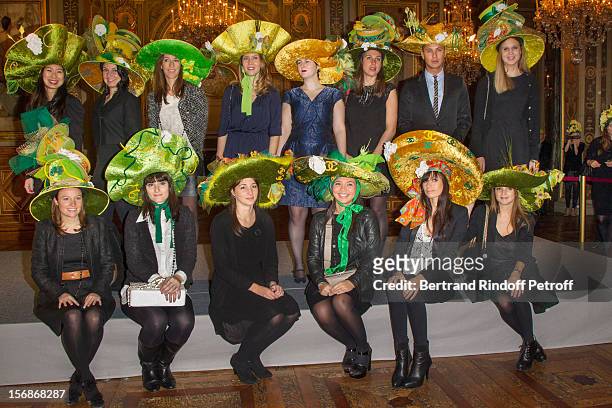 Young employees of the Chanel fashion house pose at the Paris City Hall during the Sainte-Catherine Celebration on November 23, 2012 in Paris, France.