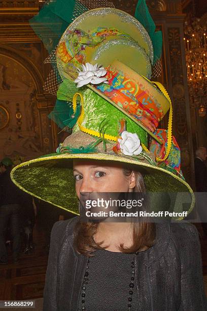 Young employee of the Chanel fashion house poses at the Paris City Hall during the Sainte-Catherine Celebration on November 23, 2012 in Paris, France.