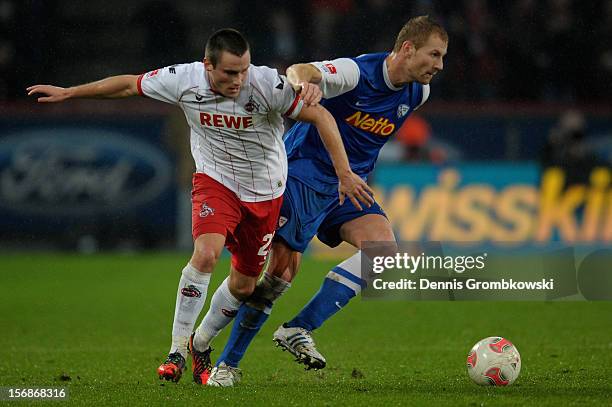 Christian Clemens of Cologne and Lukas Sinkiewicz of Bochum battle for the ball during the Second Bundesliga match between 1. FC Koeln and VfL Bochum...