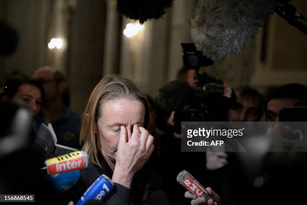 French former tennis player Isabelle Demongeot reacts as she leaves the courtroom, on November 23, 2012 at the Lyon courthouse, at the end of the...