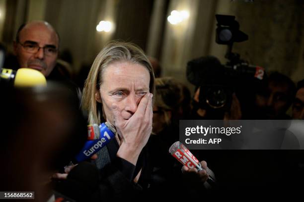 French former tennis player Isabelle Demongeot reacts as she leaves the courtroom, on November 23, 2012 at the Lyon courthouse, at the end of the...