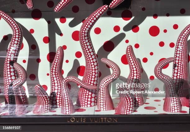 Sculptures by avante garde Japanese artist Yayoi Kusama fill the window display at the Louis Vuitton shop in Aspen, Colorado. The artist and the...