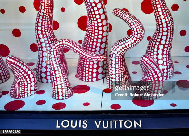 Sculptures by avante garde Japanese artist Yayoi Kusama fill the window display at the Louis Vuitton shop in Aspen, Colorado. The artist and the...