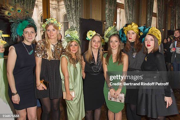 Young employees of the Lanvin fashion house pose at the Paris City Hall during the Sainte-Catherine Celebration on November 23, 2012 in Paris, France.