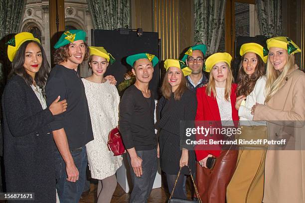 Young employees of the Chloe fashion house pose at the Paris City Hall during the Sainte-Catherine Celebration on November 23, 2012 in Paris, France.