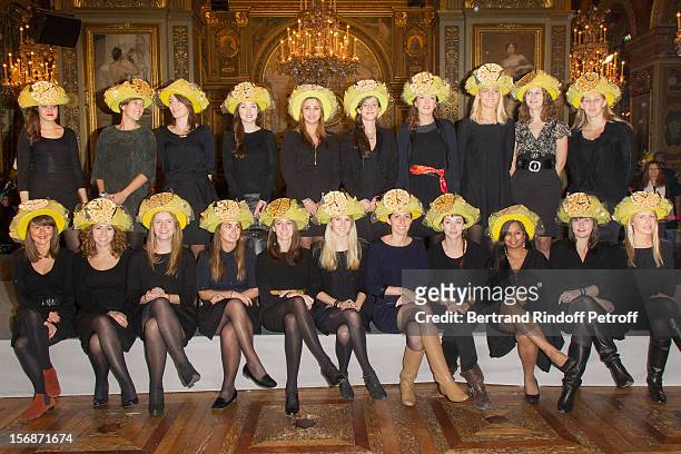 Young employees of the Hermes fashion house pose at the Paris City Hall during the Sainte-Catherine Celebration on November 23, 2012 in Paris, France.