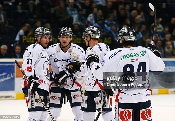 Mark Katic of Berlin celebrates with his team mates after scoring his team's first goal during the DEL match between Hamburg Freezers and Eisbaeren...