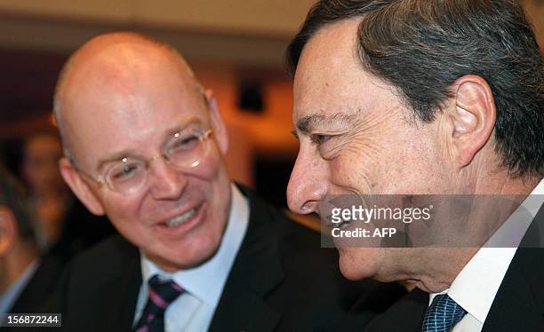 Mario Draghi, President of the European Central Bank ECB, and Martin Blessing, CEO of the Commerzbank talks during the European Banking Congress EBC...
