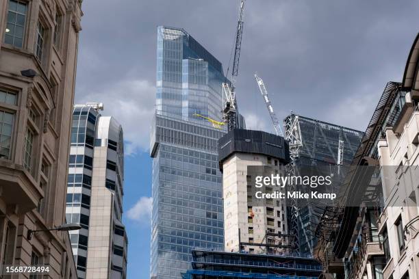 Looking up amidst the giant glass architectural towers as One Leadenhall, the latest addition is under construction in the City of London on 6th July...